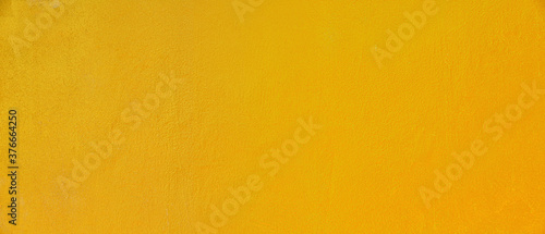 Gold texture background. Concrete wall texture paint, gold color surface blank for design