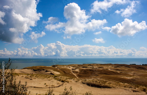 Fototapeta Naklejka Na Ścianę i Meble -  Sand dunes and blue sky with clouds