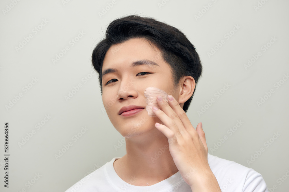 men apply clay mask