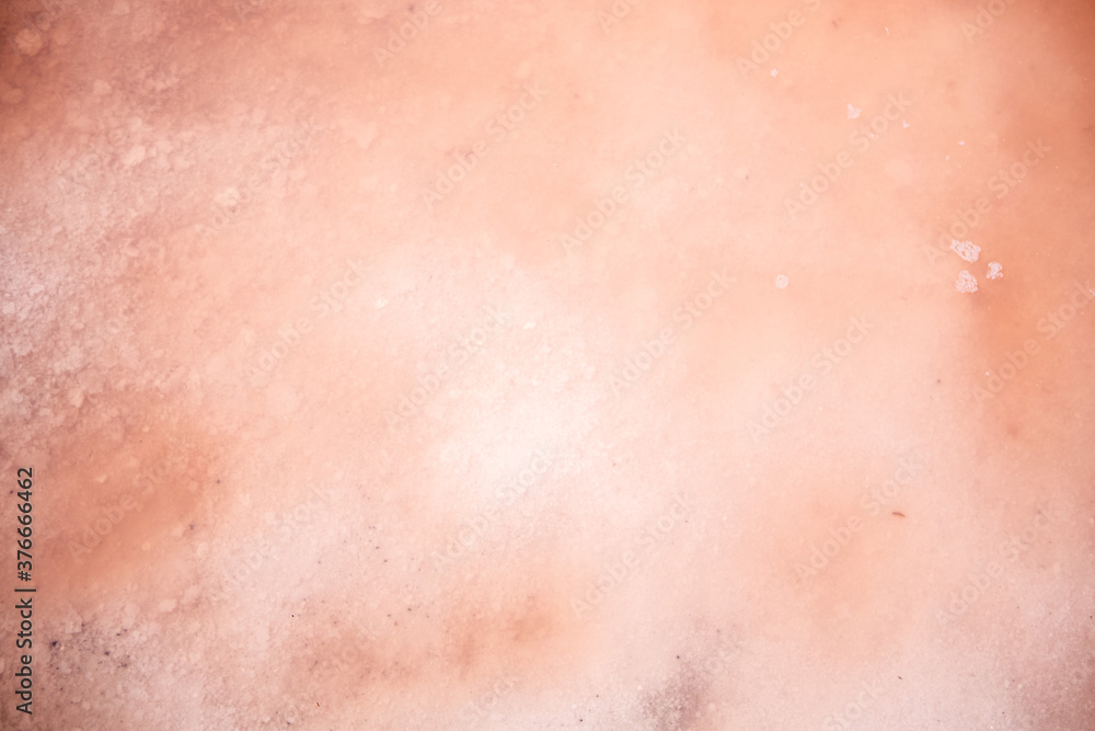 background and texture of pink lake, salt covered with water