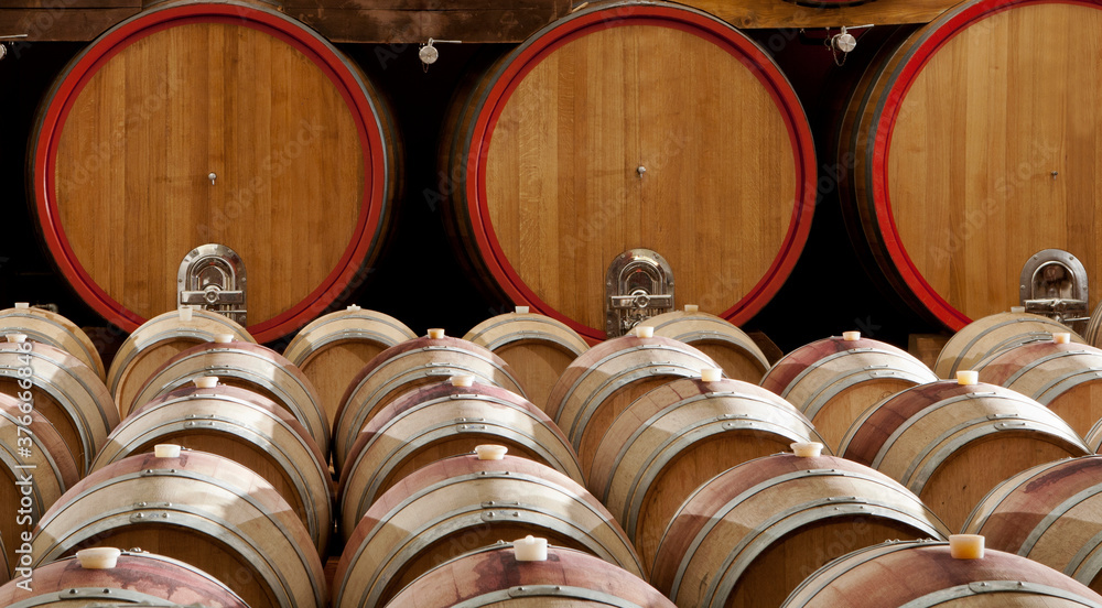 Wine barrels stacked in the old cellar Wine barrels stacked in the old cellar