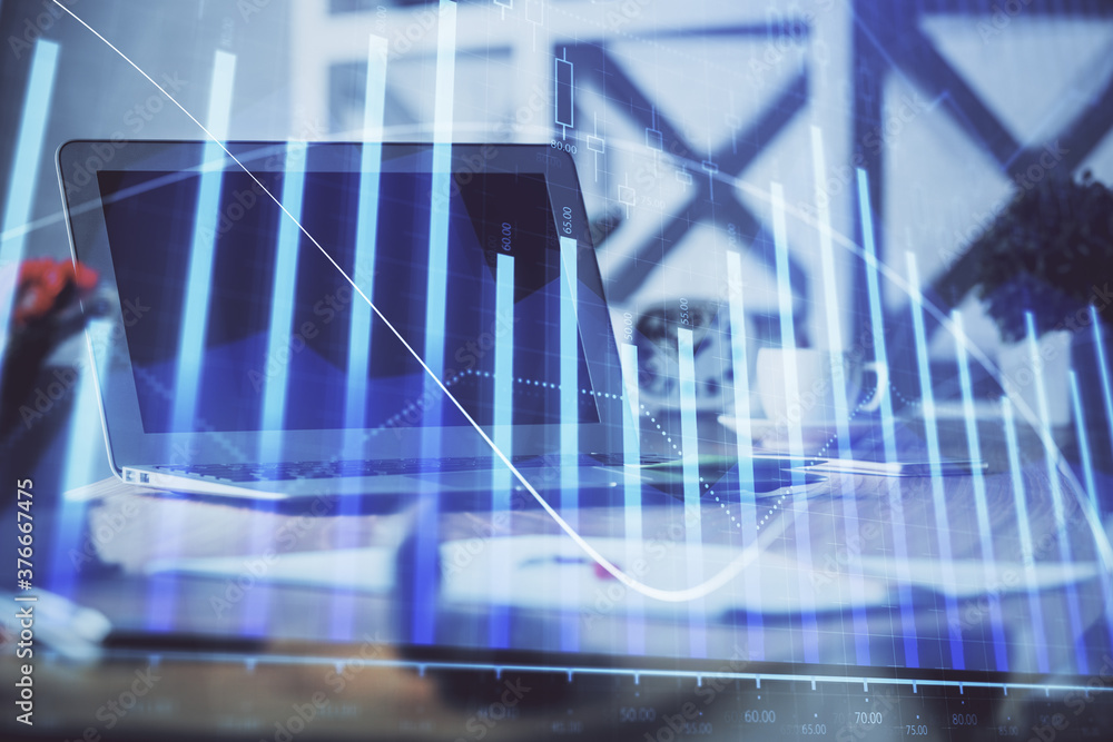 Stock market graph and table with computer background. Double exposure. Concept of financial analysis. Stock market graph and table with computer background. Double exposure. Concept of financial analysis.