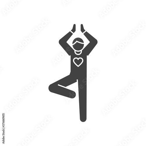 Faceless person stands in tree pose vrikshasana black glyph icon. Yoga pose. Asana. Home leisure. Vector isolated illustration.