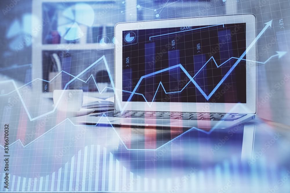 Financial market graph hologram and personal computer on background. Multi exposure. Concept of forex. Financial market graph hologram and personal computer on background. Multi exposure. Concept of forex.