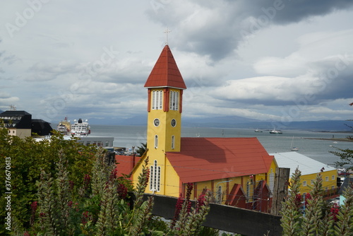 Argentina, Patagonia, City of Ushuaia.
Catholic Church Nuestra Señora de la Merced and in the background the Habour. photo