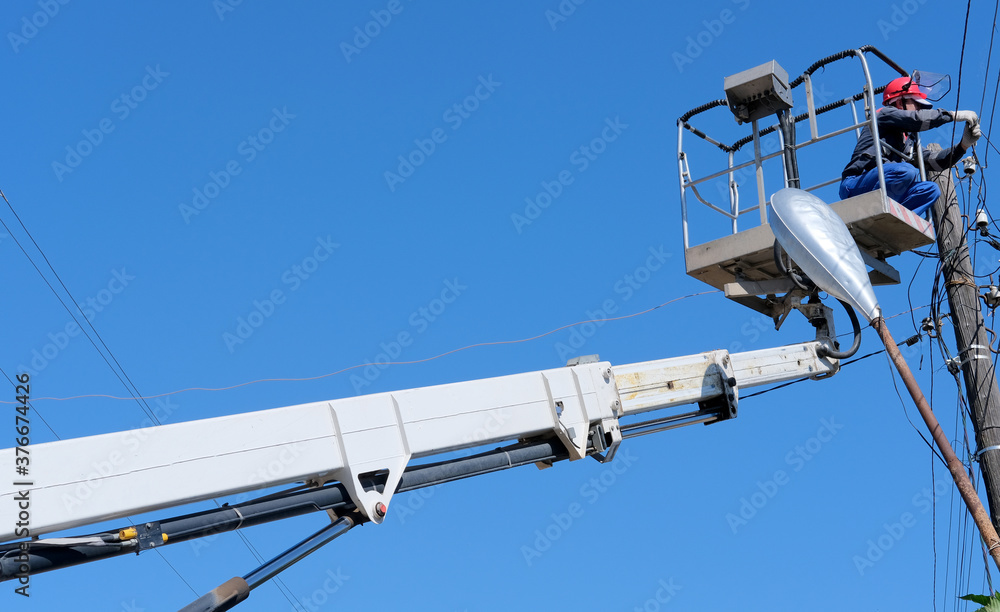 lectrician man serves electrical lines and pole at height using lectrician man serves electrical lines and pole at height using