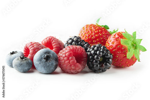 Ripe strawberries, raspberries,  blueberries and blackberries isolated on white background. Full depth of field