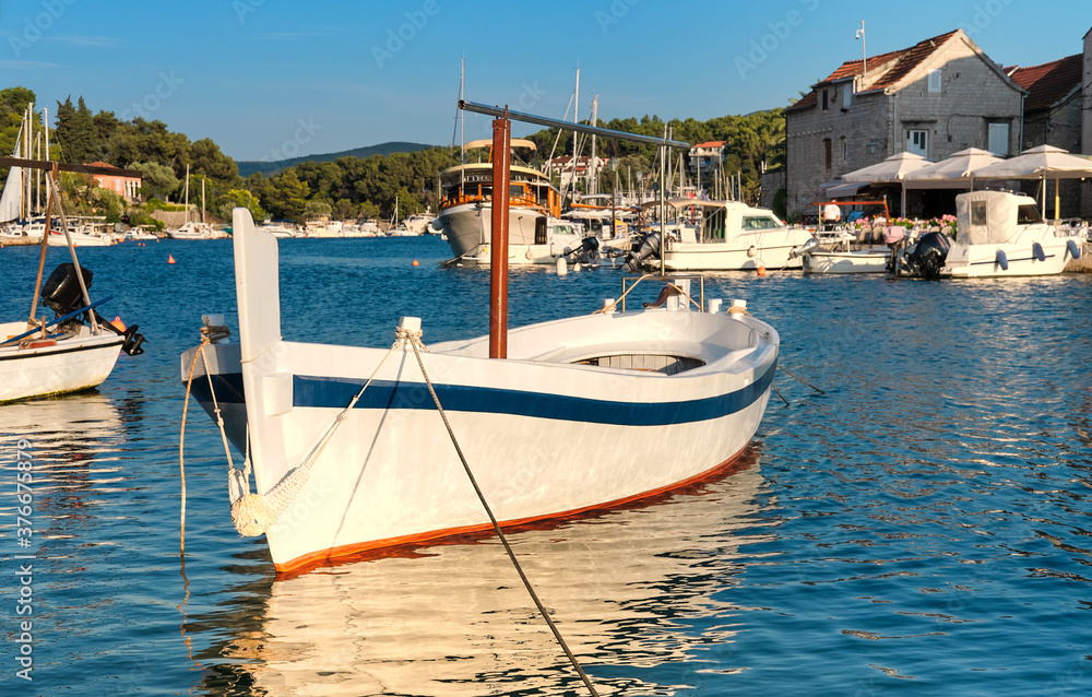 Fisherman boats and houses in Vrboska village, Hvar island, Dalmatia, Croatia, Europe.