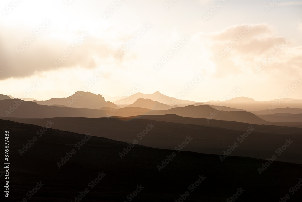 Highlands - Iceland - Golden sunset in the silhouette mountains