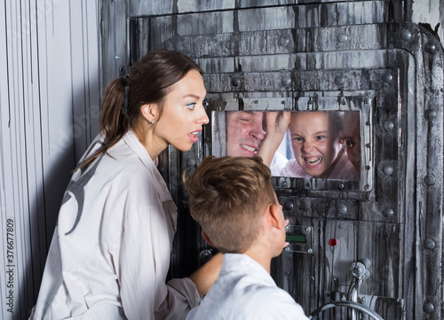 Vászonkép Family is saving each other from being locked up in lost room.