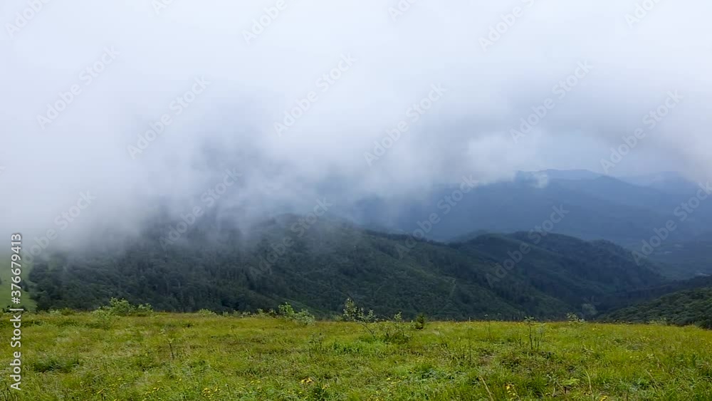 Carpathian mountains, Beskids region on a summer day with cloudy and foggy skies. Summer fogs in the Carpathian mountains Carpathian mountains, Beskids region on a summer day with cloudy and foggy skies. Summer fogs in the Carpathian mountains