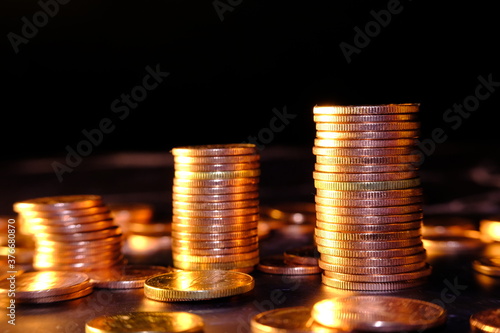Coins stacked on black background and Advertising coins of finance and banking