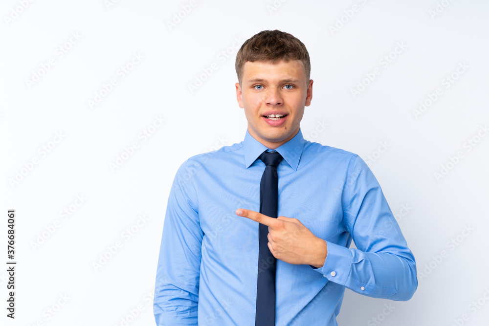 Young handsome businessman pointing finger to the side Young handsome businessman pointing finger to the side