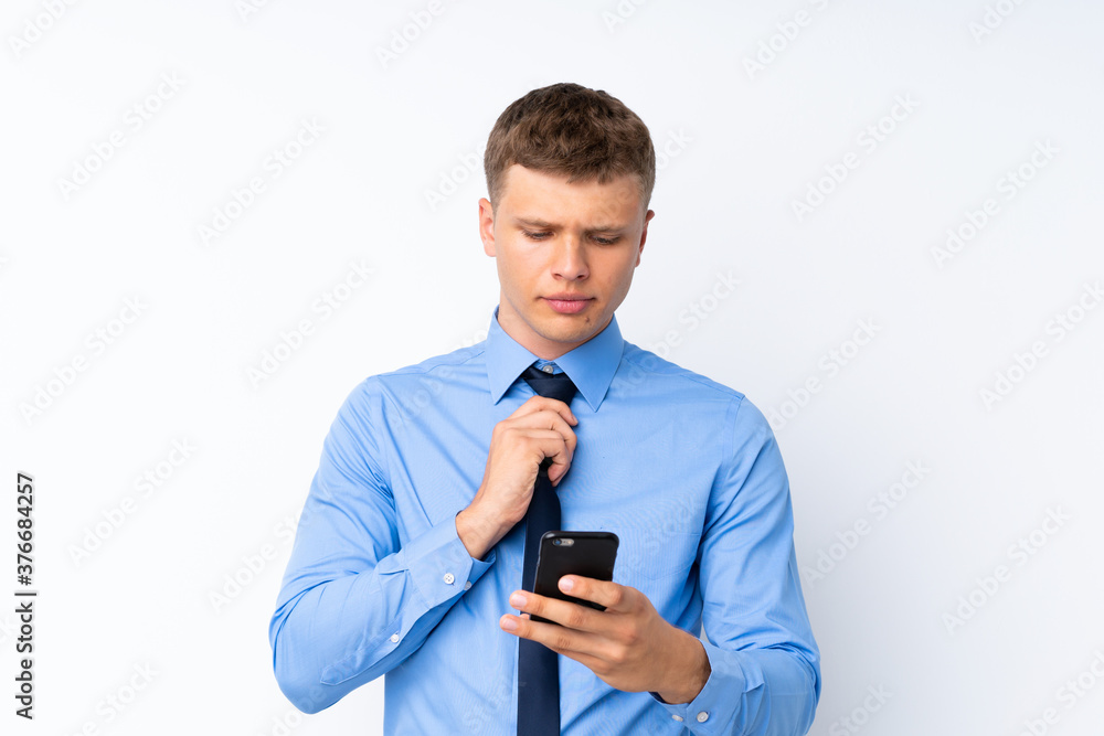 Young handsome businessman over isolated white background Young handsome businessman over isolated white background