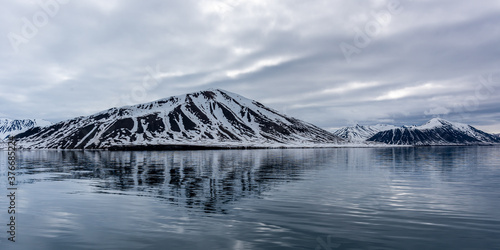 Beautiful snow covered mountains in landscapes in Svalbard, Norway.