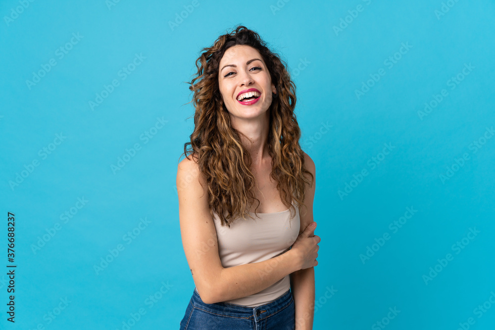 Young caucasian woman isolated on blue background laughing Young caucasian woman isolated on blue background laughing