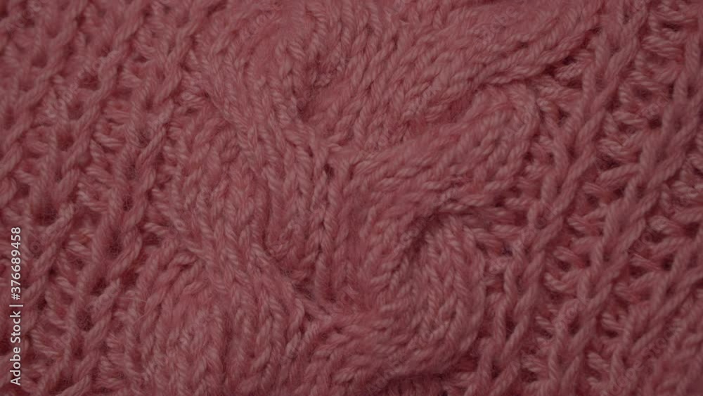 Knitted Wool background. Merino wool pink color, macro shoot. Woolen fabric.Wool clothes texture closeup, dolly shot. Knitted texture fabric. Knitted Wool background. Merino wool pink color, macro shoot. Woolen fabric.Wool clothes texture closeup, dolly shot. Knitted texture fabric.