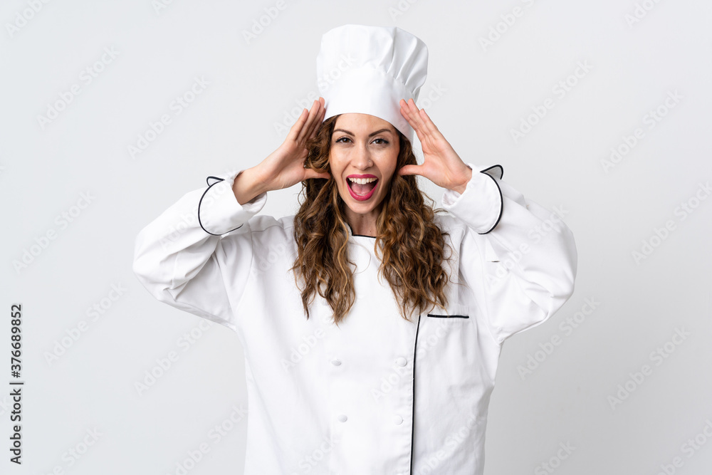 Young chef woman isolated on white background with surprise expression Young chef woman isolated on white background with surprise expression
