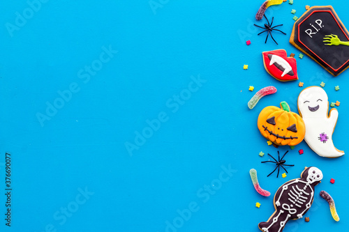 Set of Halloween cookies with candies flat lay  overhead view