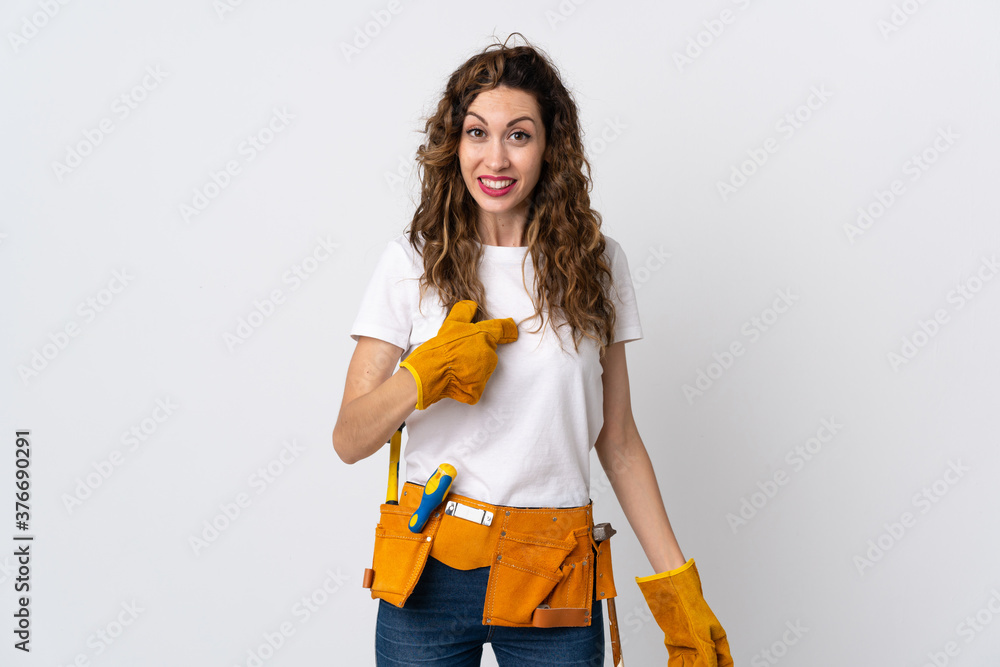 Young electrician man isolated on white background with surprise facial expression Young electrician man isolated on white background with surprise facial expression