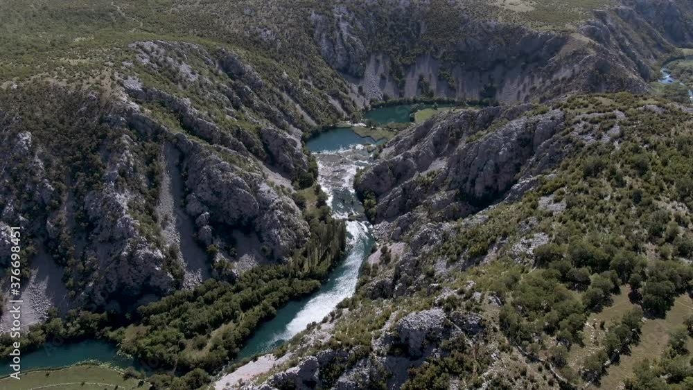 Flowing River in Breathtaking Scenic Valley in Croatia Wilderness - Overhead Aerial View Flowing River in Breathtaking Scenic Valley in Croatia Wilderness - Overhead Aerial View