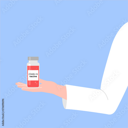 The doctor holds and shows the pink vaccine. Presentation of the vaccine against coronavirus.