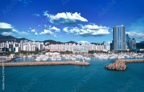 Haeundae I Park Marina and Gwangalli Beach with yacht pier at daytime in Busan, South Korea.