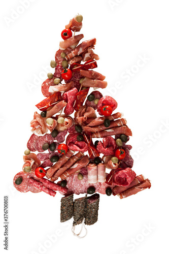 Christmas tree made of sausage on a background of a wooden wall