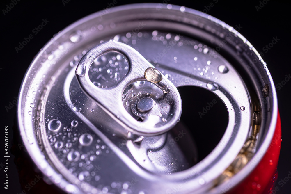 Open aluminum can with water drops or dew close-up macro shot, top view Open aluminum can with water drops or dew close-up macro shot, top view