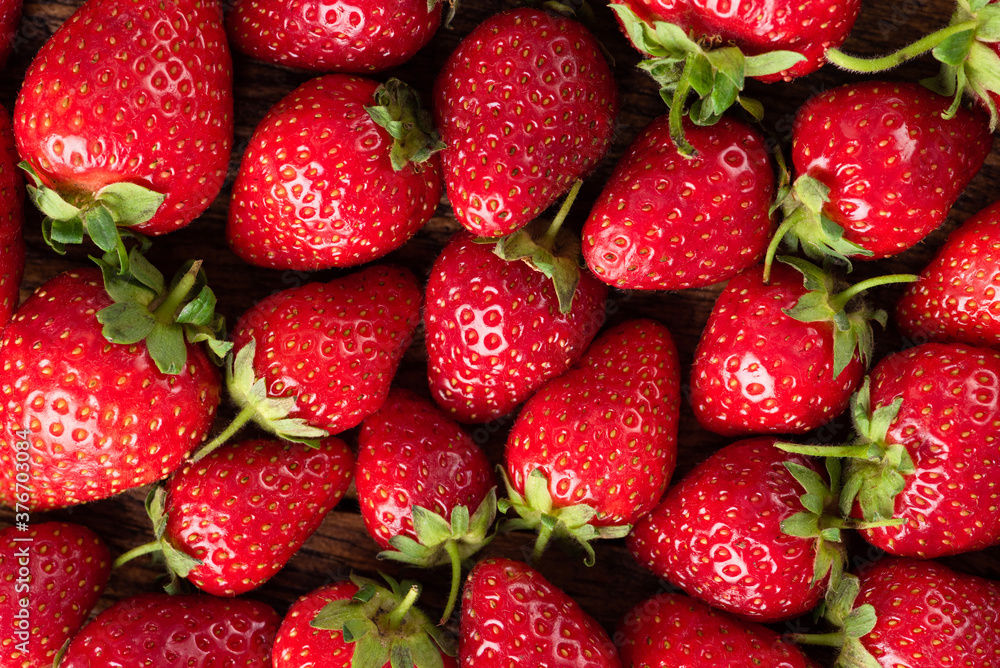 Strawberries as a background. Group of fresh organic strawberries Strawberries as a background. Group of fresh organic strawberries