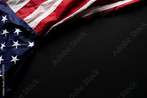 Happy Veterans Day. American flag on black background with copy space.