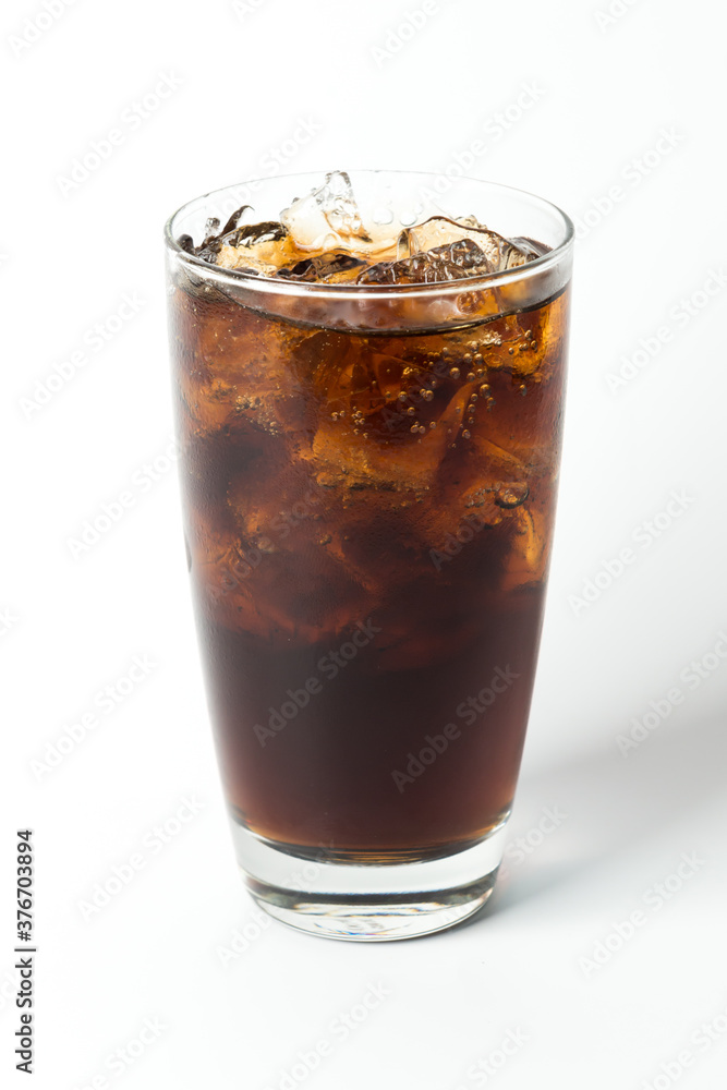 cola soft drink in clear glass on isolated white background, real iced cola soft drink in clear glass on isolated white background, real iced