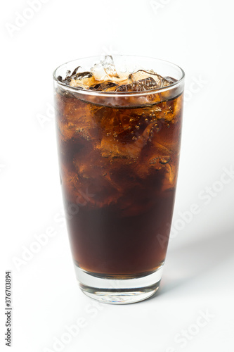 cola soft drink in clear glass on isolated white background, real iced