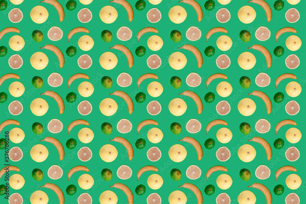 Seamless pattern tropic fruits. Banana, grapefruits and figs on green background. Healthy food concept, raw vegan.
