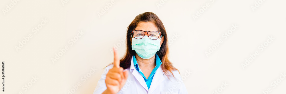 Covid19 Coronavirus people.Indian Doctor wearing surgical mask for protect from Coronavirus in india show 1 finger gesture or notice sign for warning people in Covid-19 coronavirus.New normal Covid19 Coronavirus people.Indian Doctor wearing surgical mask for protect from Coronavirus in india show 1 finger gesture or notice sign for warning people in Covid-19 coronavirus.New normal