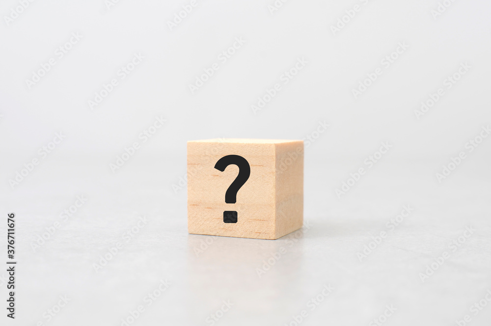 question mark sign and symbol wood cube on cement table white background question mark sign and symbol wood cube on cement table white background