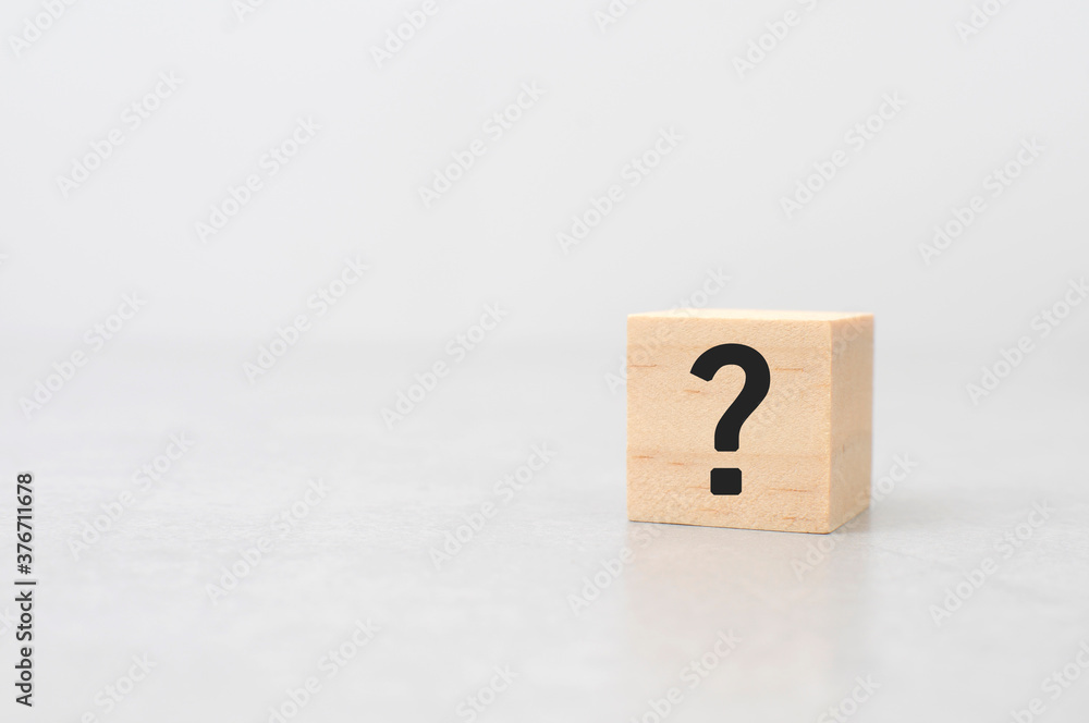 question mark on wooden block cement background question mark on wooden block cement background