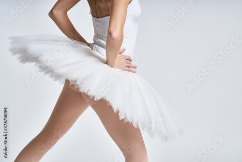 ballerina white tutu dance exercise performance light background