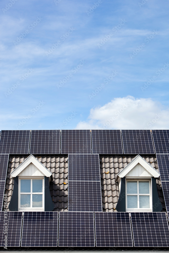 Alternative energy from solar panels on a roof with two dormers