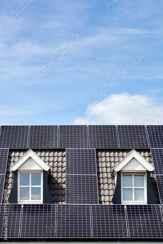 Wallpaper Mural Alternative energy from solar panels on a roof with two dormers Torontodigital.ca