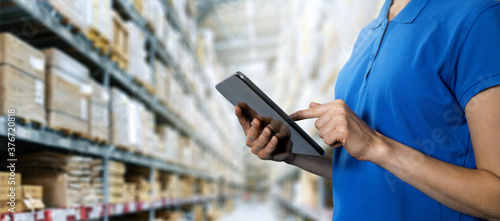 logistics service, warehouse management and inventory concept - female worker using digital tablet in warehouse. copy space photo