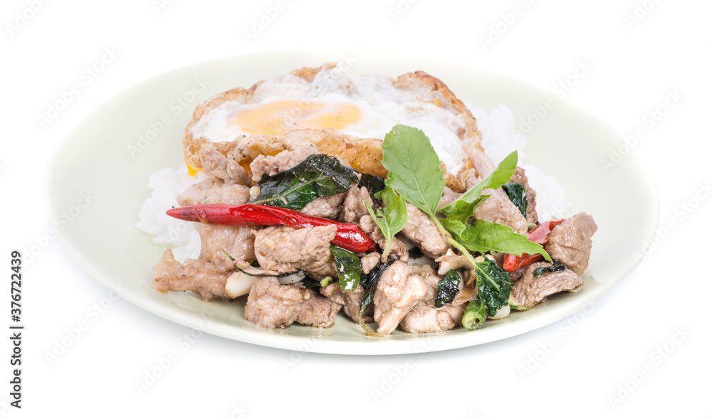 Fried Pork/Chicken with basil leaf on rice an isolated on white background Fried Pork/Chicken with basil leaf on rice an isolated on white background