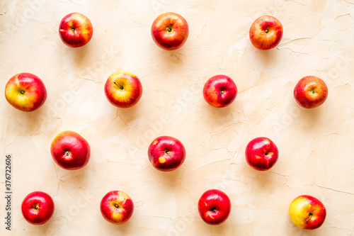 Fruit pattern of red apples on table desk top view