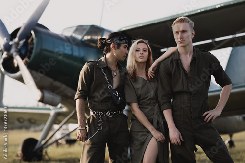 men and woman standing on the background of the plane  © Наталья Бирюкова