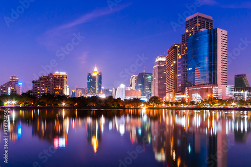 City downtown skyline at night with water reflection, Bangkok,Thailand