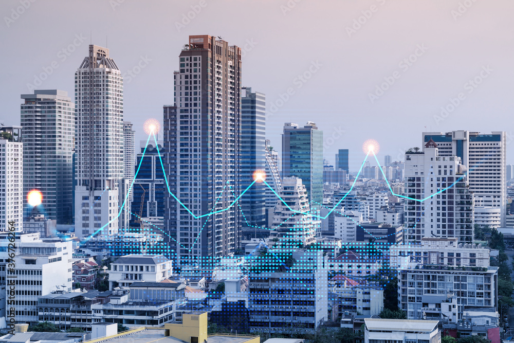 Financial stock chart hologram over panorama city view of Bangkok, business center in Asia. The concept of international transactions. Double exposure.