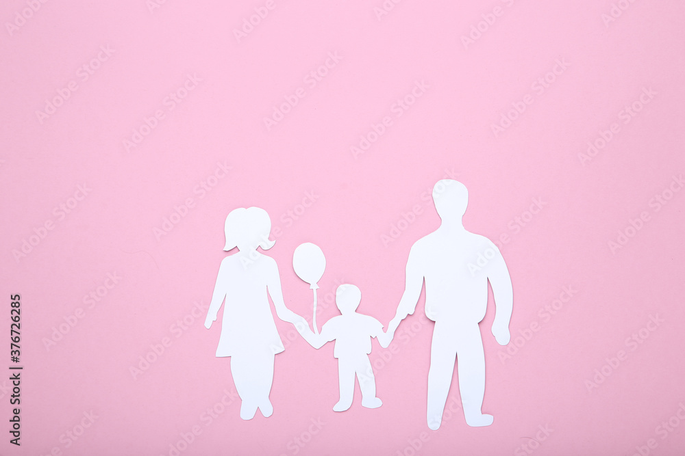 Family figures on pink background Family figures on pink background