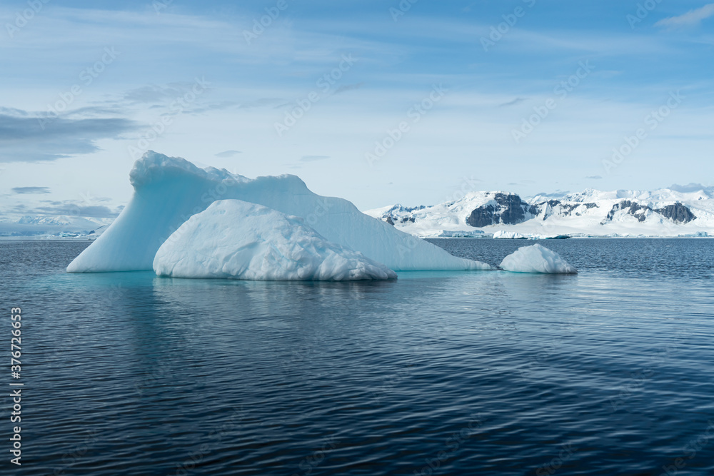 Antarctica, antarctic Peninsula, after crossing the circle line. Landscape along the Bouregois Fjord with floating Icebergs and ice floes. Antarctica, antarctic Peninsula, after crossing the circle line. Landscape along the Bouregois Fjord with floating Icebergs and ice floes.