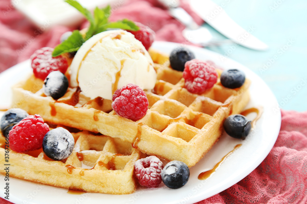Tasty waffles with fresh berries and ice cream Tasty waffles with fresh berries and ice cream