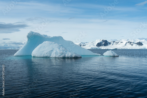 Antarctica, antarctic Peninsula, after crossing the circle line. Landscape along the Bouregois Fjord with floating Icebergs and ice floes.